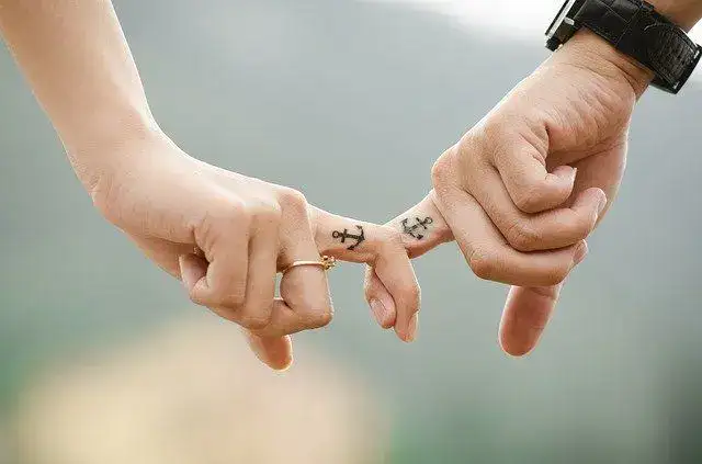 a couple with fingers interlocked - sex and Hinduism