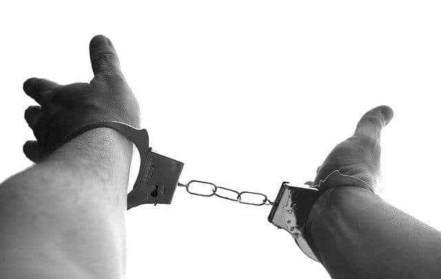 Hands and handcuffs